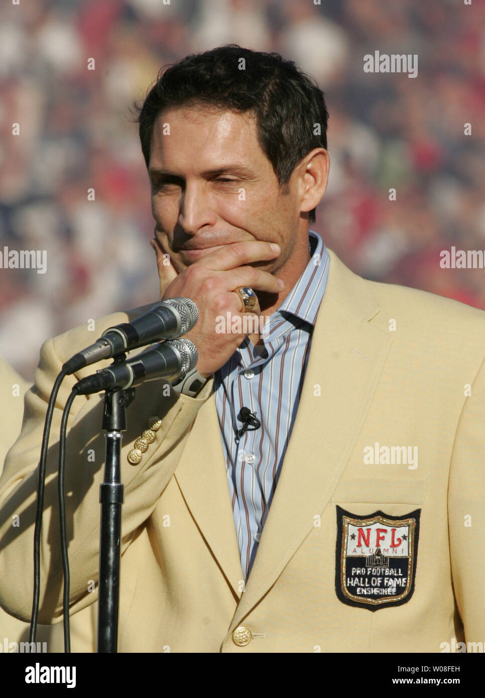 Hall of Fame QB Steve Young waits for the applause to stop before speaking at Monster Park in San Francisco on November 20, 2005. Young was honored as a new enshrinee to the Hall.  (UPI Photo/Terry Schmitt) Stock Photo