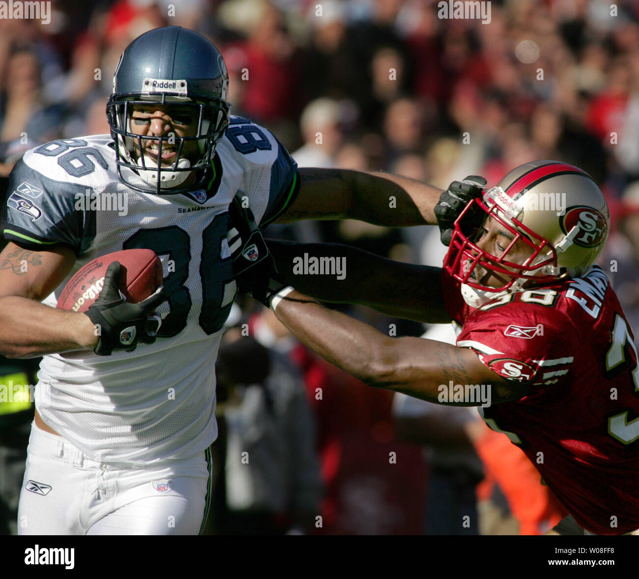 Seattle Seahawks' TE Jerramy Stevens (86) tries to push away San Francisco 49ers' Ben Emanuel at Monster Park in San Francisco on November 20, 2005.   (UPI Photo/Terry Schmitt) Stock Photo