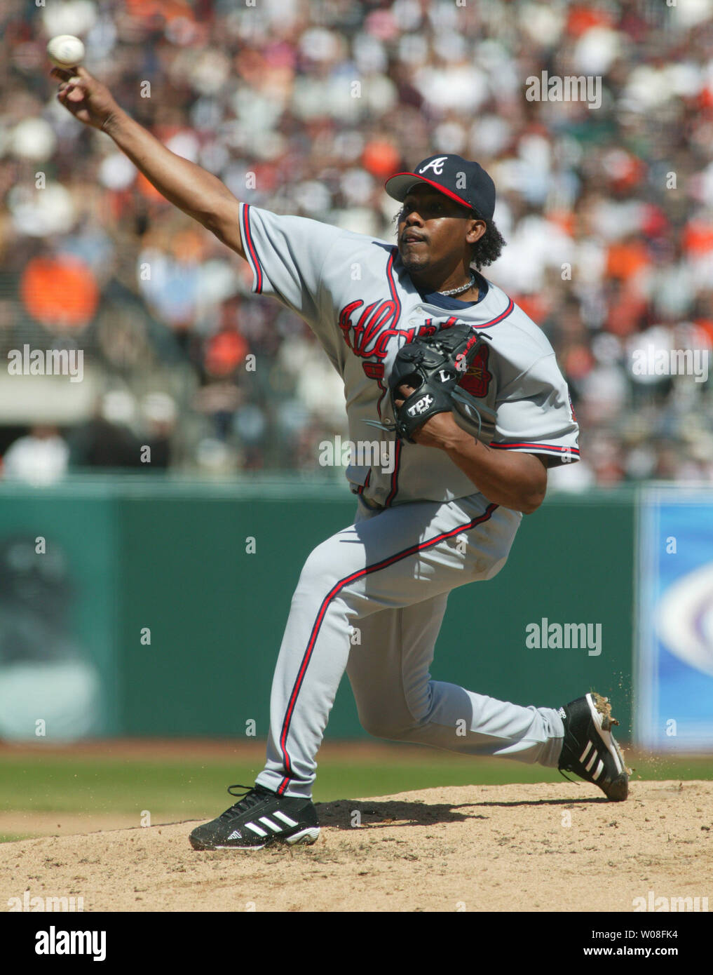 Atlanta Braves' starting pitcher Jorge Sosa, left, walks back to