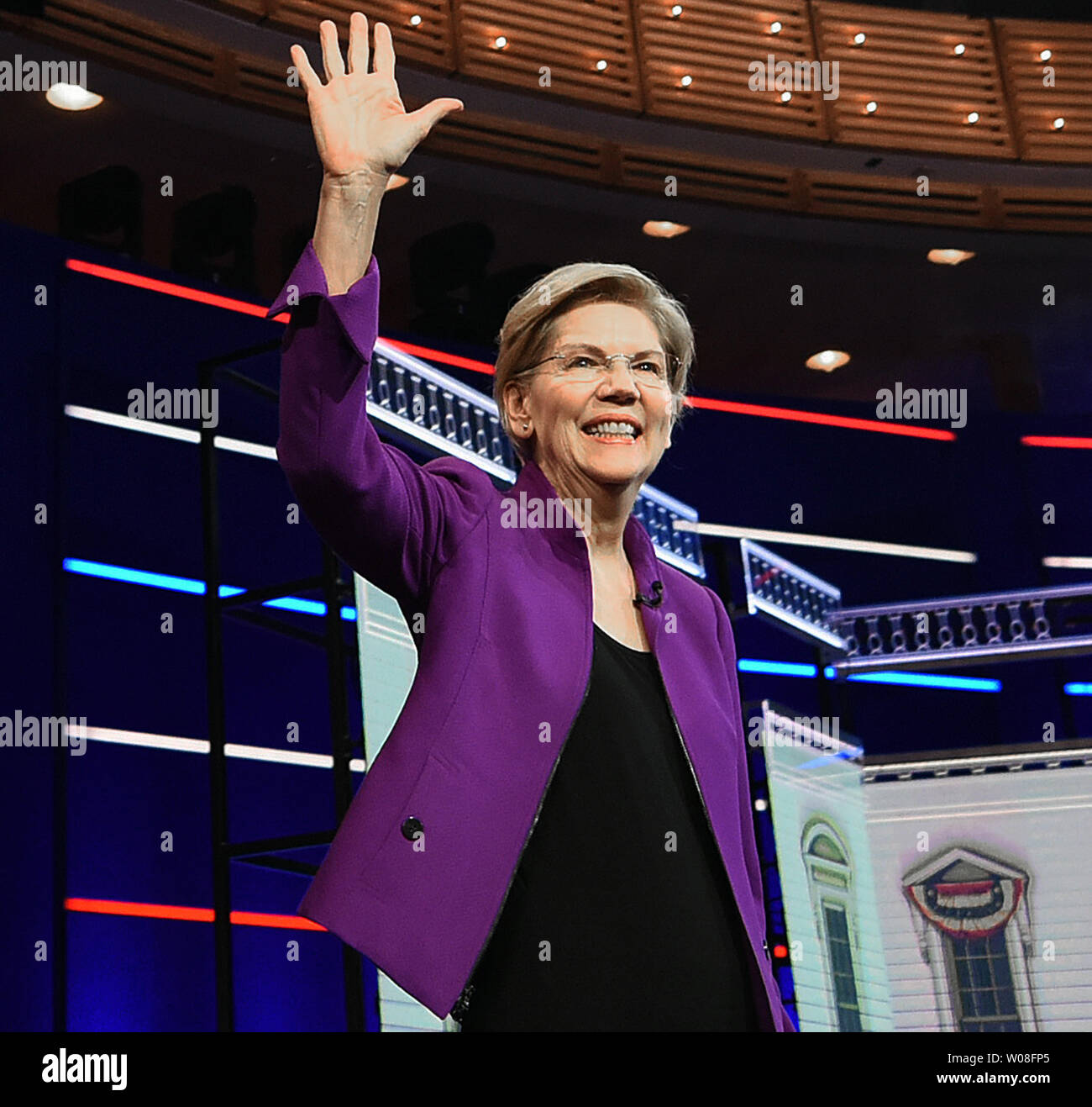 Miami, United States. 26th June, 2019. Democratic presidential candidate Elizabeth Warren takes the stage at the start of the first Democratic presidential primary debate for the 2020 election on June 26, 2019 at the Knight Concert Hall at the Adrienne Arsht Center for the Performing Arts in Miami, Florida. Credit: Paul Hennessy/Alamy Live News Stock Photo