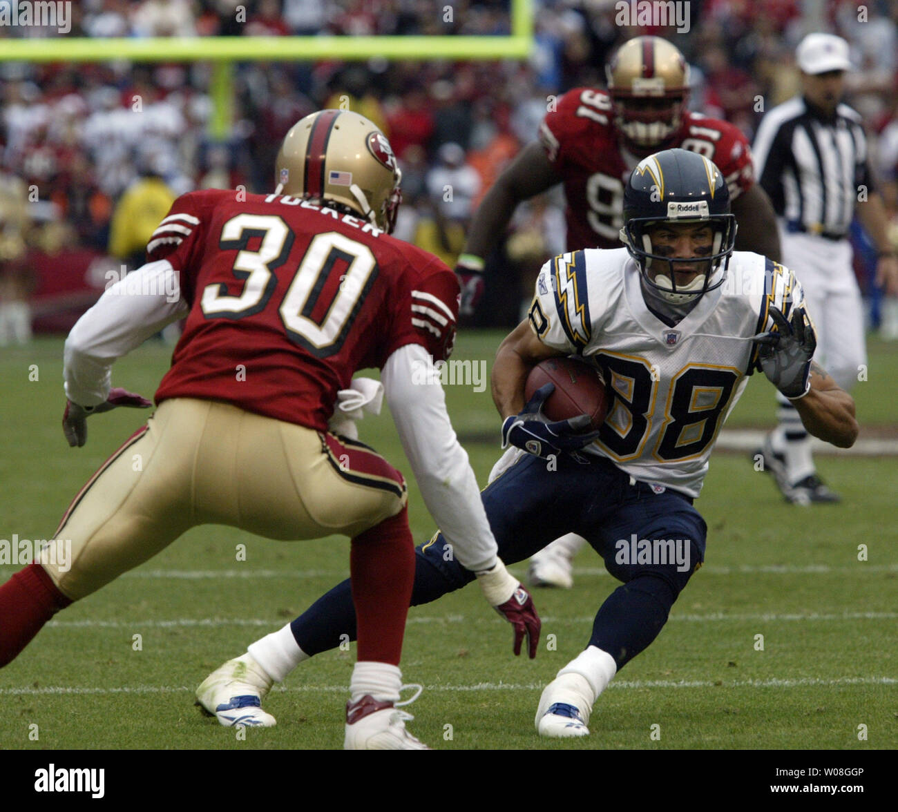 San Diego Chargers Eric Parker (88) tries to cut around San Francisco 49ers B.J. Tucker (30) for an 11yard gain in the second quarter at Monster Park in San Francisco on October  15, 2006.  The Chargers defeated the 49ers 48-19. (UPI Photo/Bruce Gordon) Stock Photo
