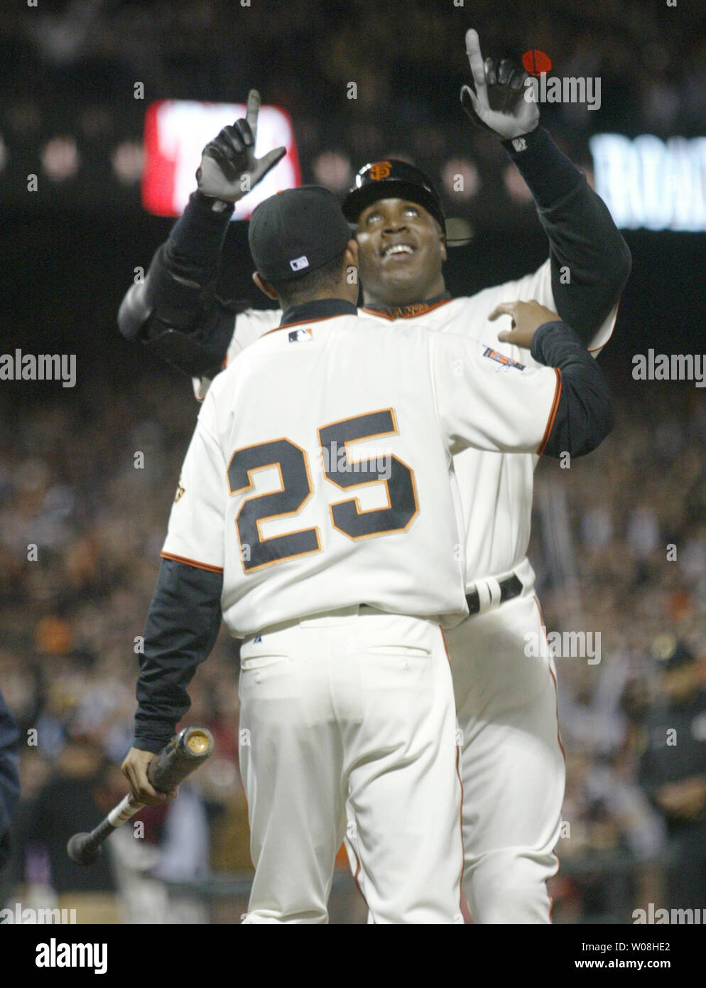 San Francisco Giants Barry Bonds celebrates at home plate with his son Nikolai after hitting his 756th career home run passing Hank Aaron for the all time home run record against the Washington Nationals at AT&T Park in San Francisco on August 7, 2007.    (UPI Photo/Bruce Gordon) Stock Photo
