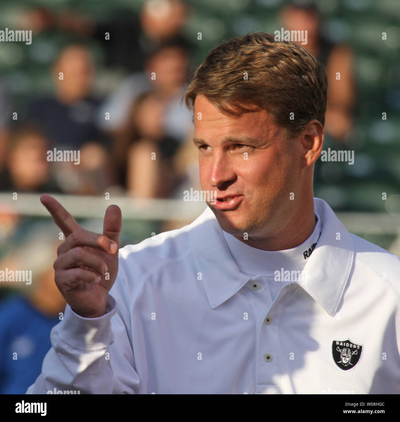 Oakland Raiders Head Coach Lane Kiffin watches his team warm up to play the St. Louis Rams at McAfee Coliseum in Oakland, California on August 24, 2007.    (UPI Photo/Terry Schmitt) Stock Photo
