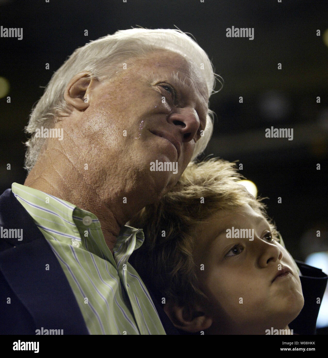 San Francisco Giants owner Peter McGowan cries as he hugs his grandson Alexander Harper following Barry Bonds last at bat in his final game at AT&T Park in San Francisco on September 26, 2007.  Bonds went 0-3 against the San Diego Padres.  (UPI Photo/Bruce Gordon) Stock Photo