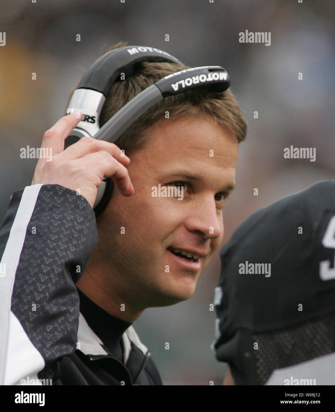 Oakland Raiders head coach Lane Kiffin talks with a player during play against  the Indianapolis Colts at Oracle Coliseum in Oakland, California on December 16, 2007.  The Colts defeated the Raiders 21-14.  (UPI Photo/Terry Schmitt) Stock Photo