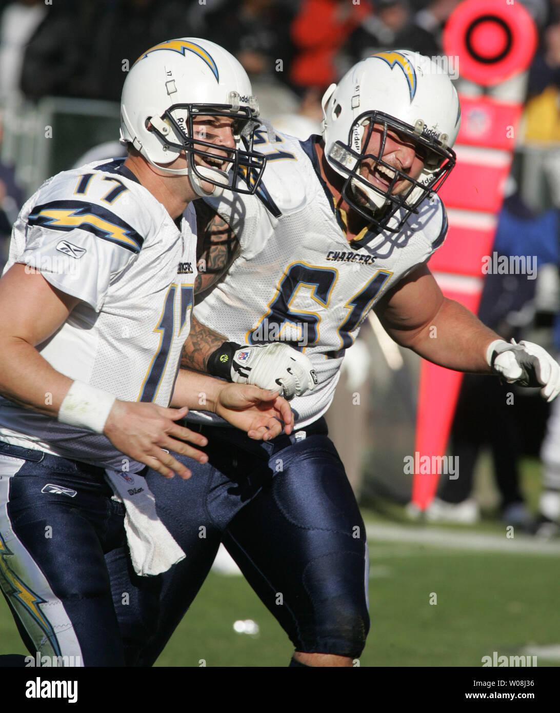 San Diego Chargers QB Philip Rivers (L) and center Nick Hardwick (61) celebrate a TD against the Oakland Raiders in the second quarter at Network Associates Coliseum in Oakland, California  on December 30, 2007. The Chargers defeated the Raiders 30-17.    (UPI Photo/Terry Schmitt) Stock Photo