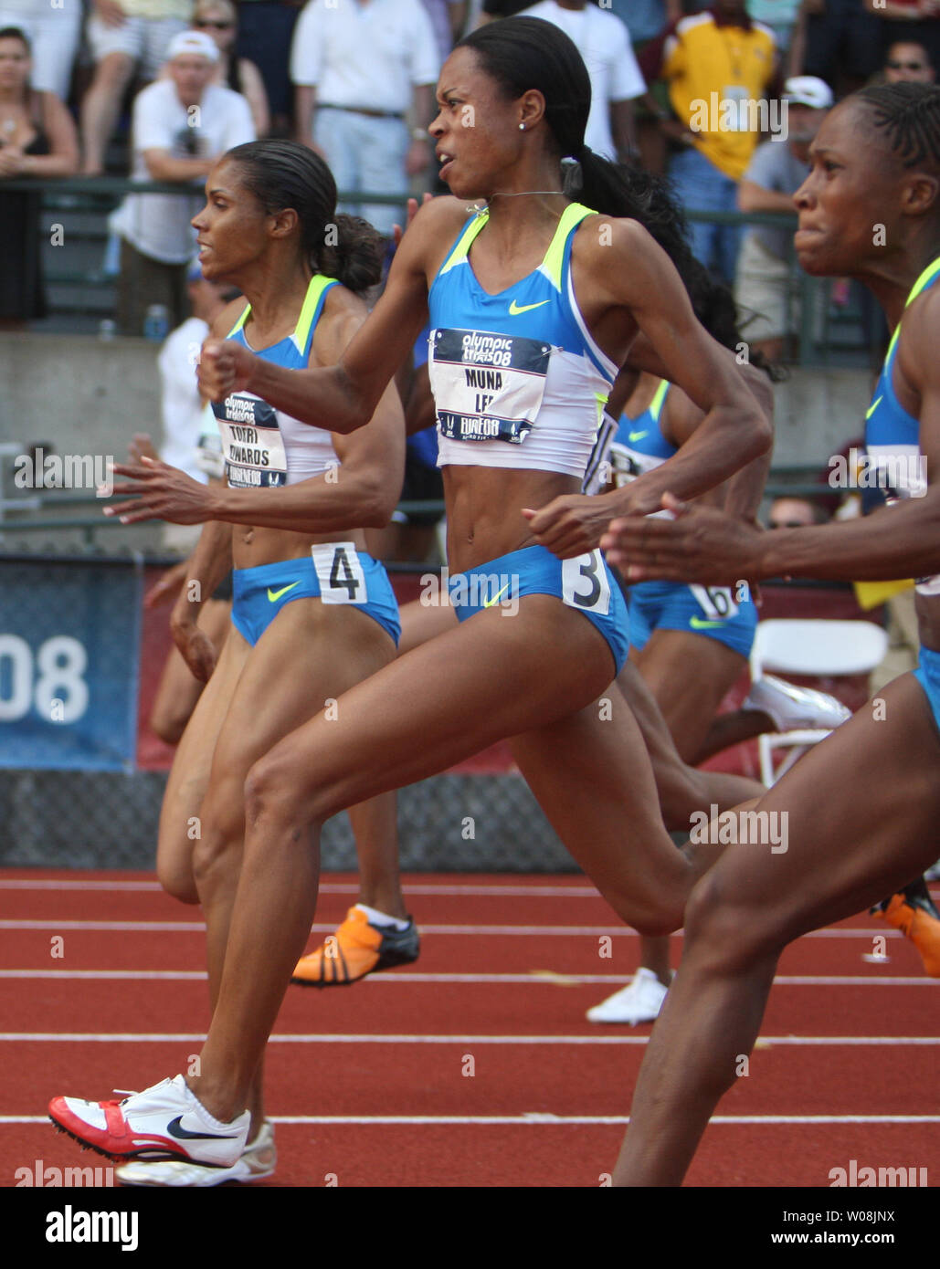 U.S. sprinter Muna Lee (C) makes her move past Torri Edwards (L) and Lauryn Williams in the finals of the 100 meters at the USA Track and Field trials in Eugene Oregon on June 28, 2008. Lee won the race, but all three qualified for the U.S. Olympic team.    (UPI Photo/Terry Schmitt) Stock Photo