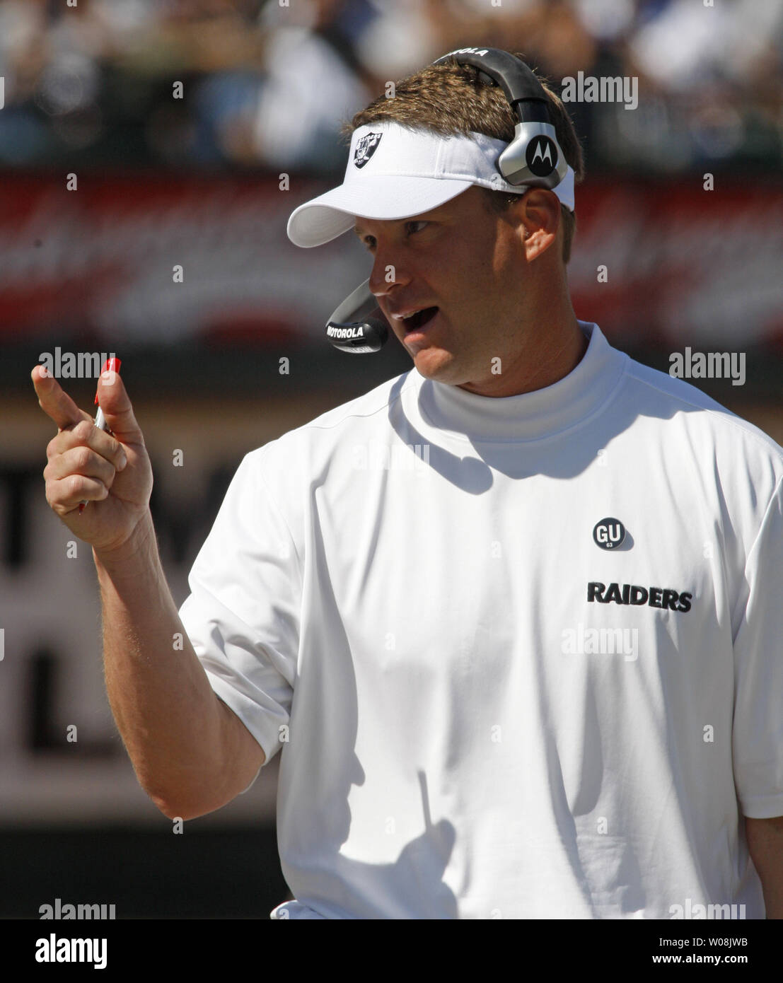 Oakland Raiders head coach Lane Kiffin has a word with a player  during play against the San Diego Chargers at the Coliseum in Oakland, California on September 28, 2008. The Chargers defeated the Raiders 28-18.  (UPI Photo/Terry Schmitt) Stock Photo