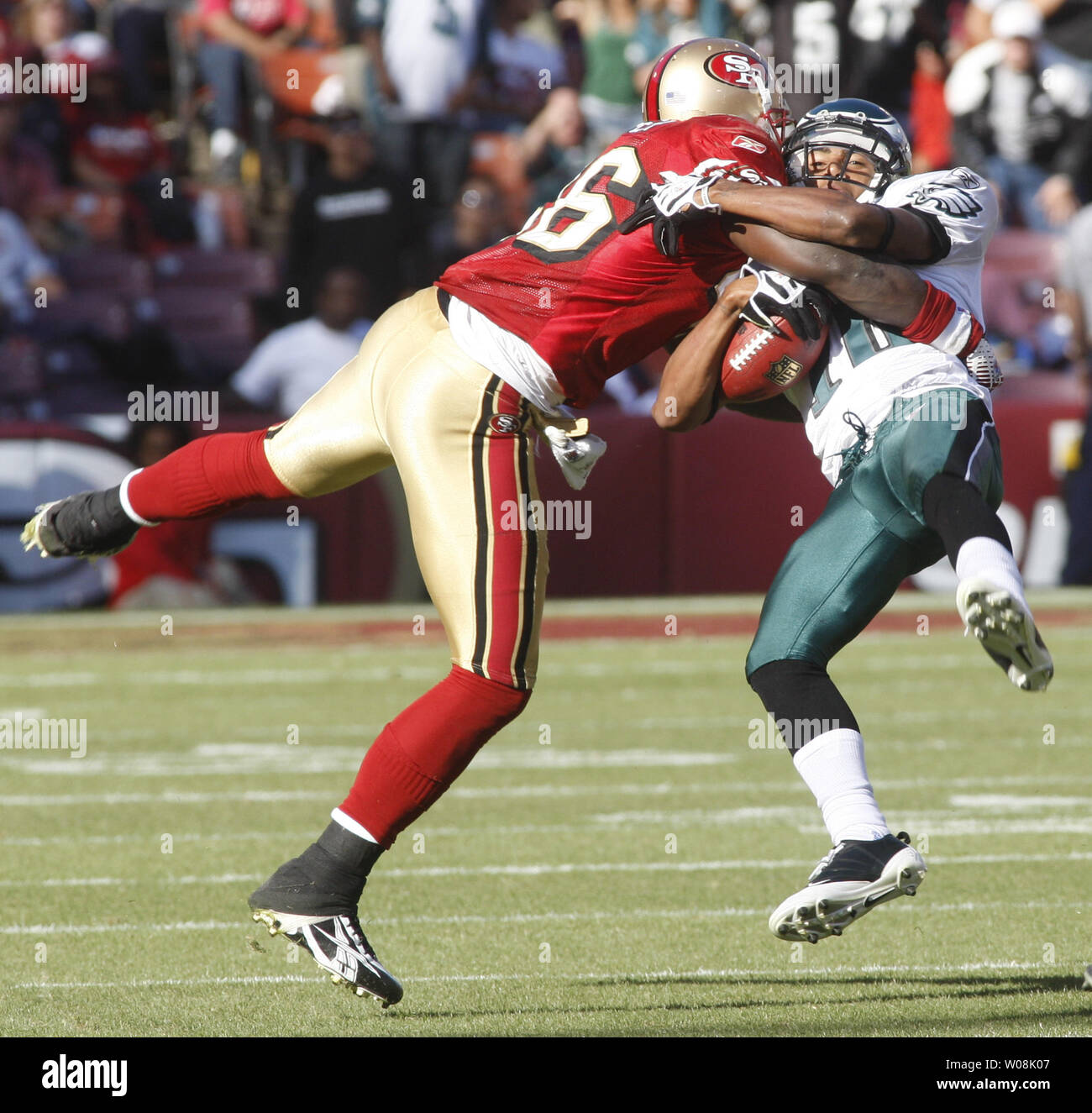 Philadelphia Eagles WR DeSean Jackson (R) is knocked off his feet by  San Francisco 49ers Delanie Walker (L) at Candlestick Park in San Francisco on October 12, 2008. The Eagles defeated the 49ers 40-26.  (UPI Photo/Terry Schmitt) Stock Photo