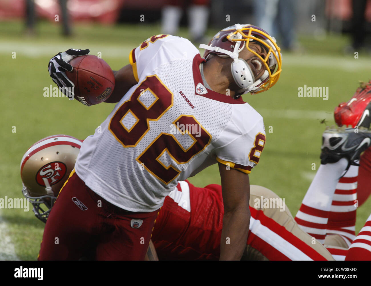 Washington Redskins WR Antwaan Randle El grimaces as he is taken down by San Francisco 49ers Michael Lewis in the third quarter at Candlestick Park in San Francisco on December 28, 2008. The Niners defeated the Redskins 27-24.   (UPI Photo/Terry Schmitt) Stock Photo