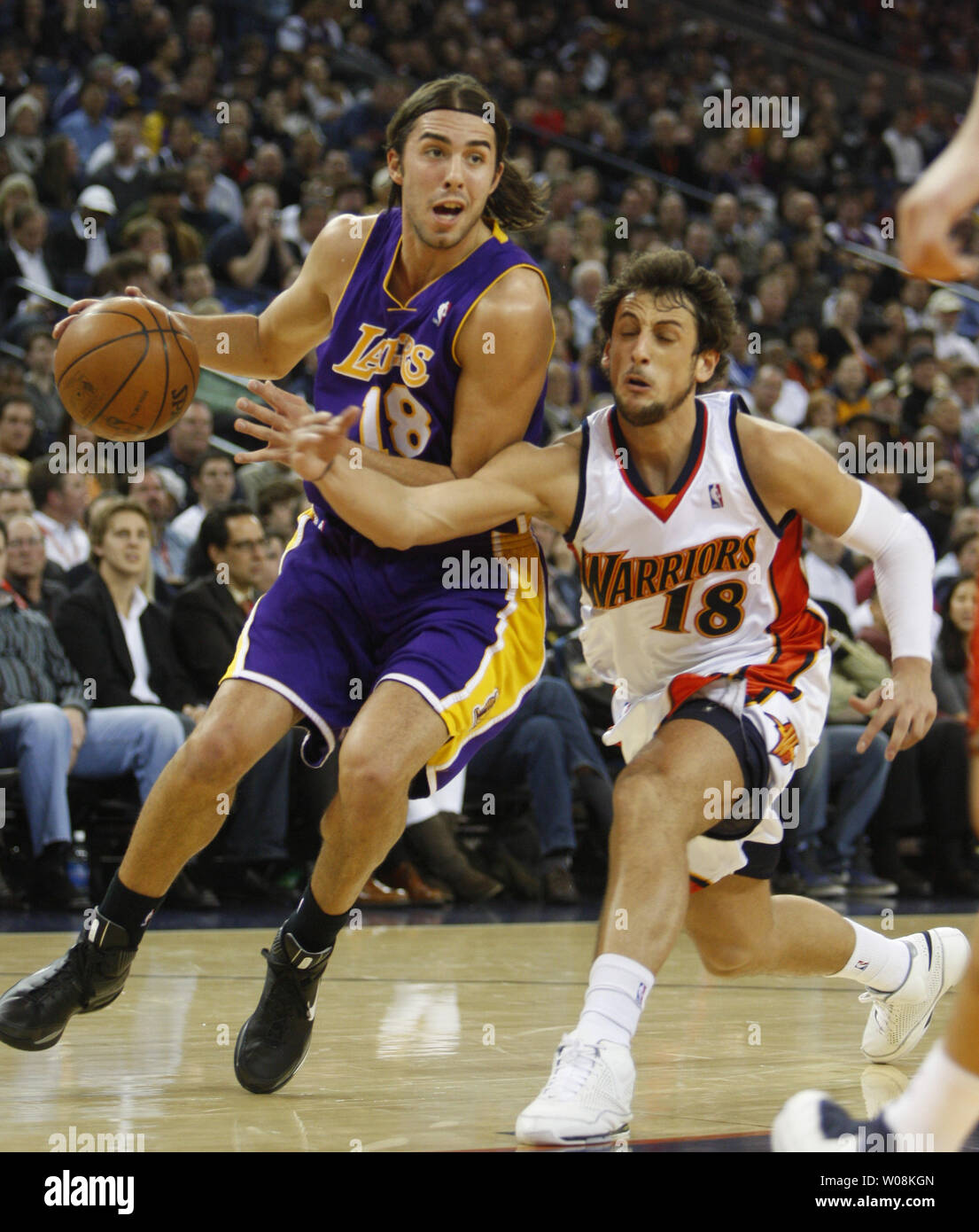 Los Angeles Lakers Sasha Vujacic (18) idrives to the baskety as Golden State Warriors Marco Belinelli of Italy tries for a steal in the first half at Oracle Arena in Oakland, California on January 7, 2009.  The Lakers won 114-106.  (UPI Photo/ Terry Schmitt) Stock Photo