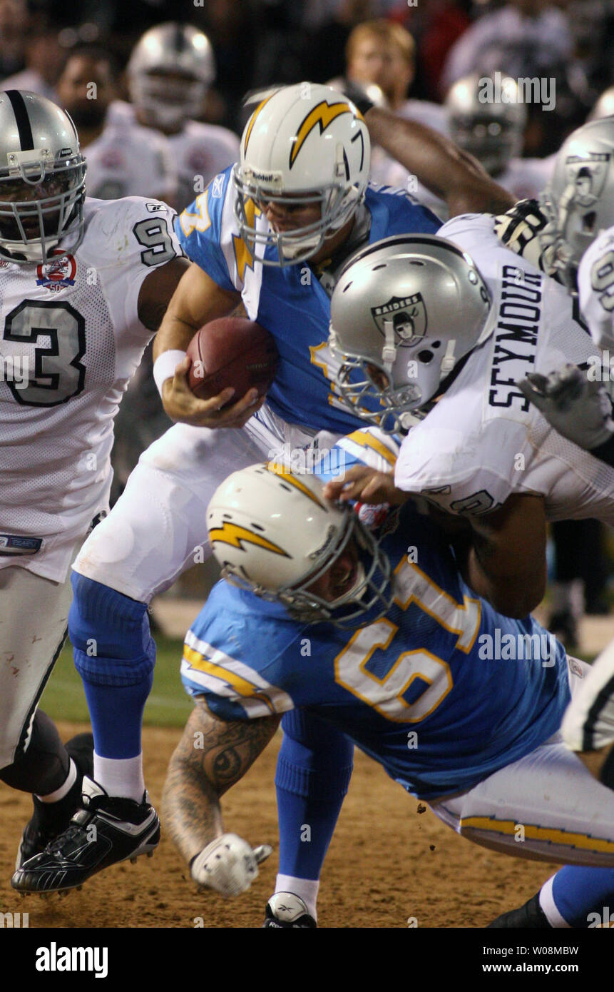 San Diego Chargers QB Philip Rivers is sacked by Oakland Raiders Richard Seymour as he powers over a block by Nick Hardwick (61) at the Oakland Coliseum in Oakland, California on September 14, 2009. The Chargers defeated the Raiders 24-20.   UPI/Terry Schmitt Stock Photo