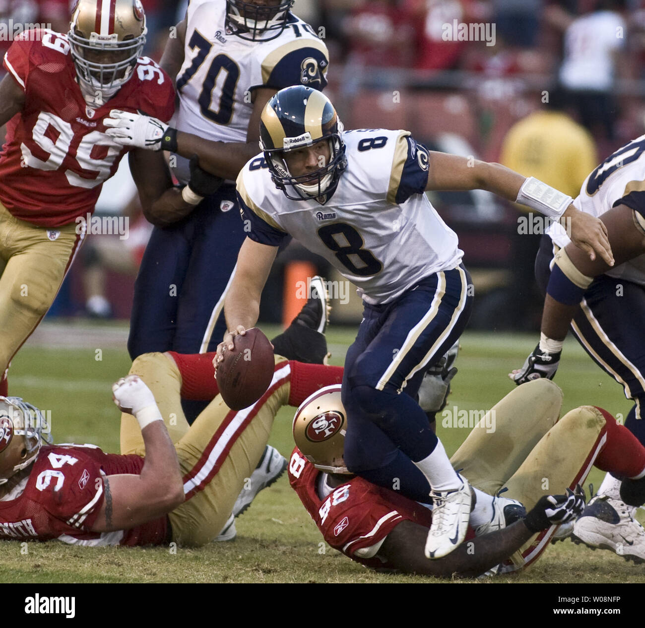 Washington Redskins QB Jason Campbell rolls out to pass pursued by San  Francisco 49ers Ray McDonald in the second quarter at Candlestick Park in  San Francisco on December 28, 2008. The Niners