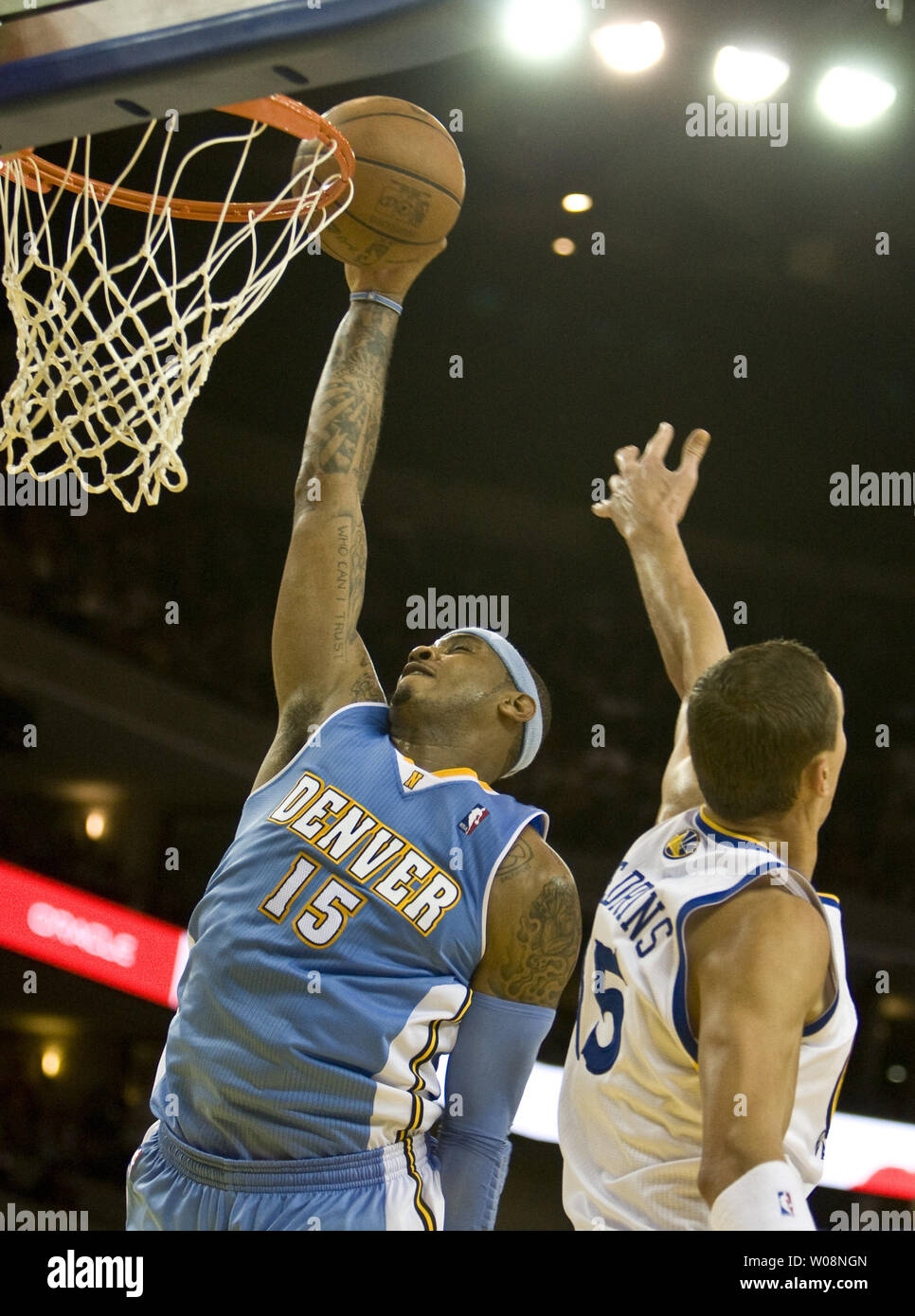 Denver Nuggets forward Carmelo Anthony (L) keeps the ball away