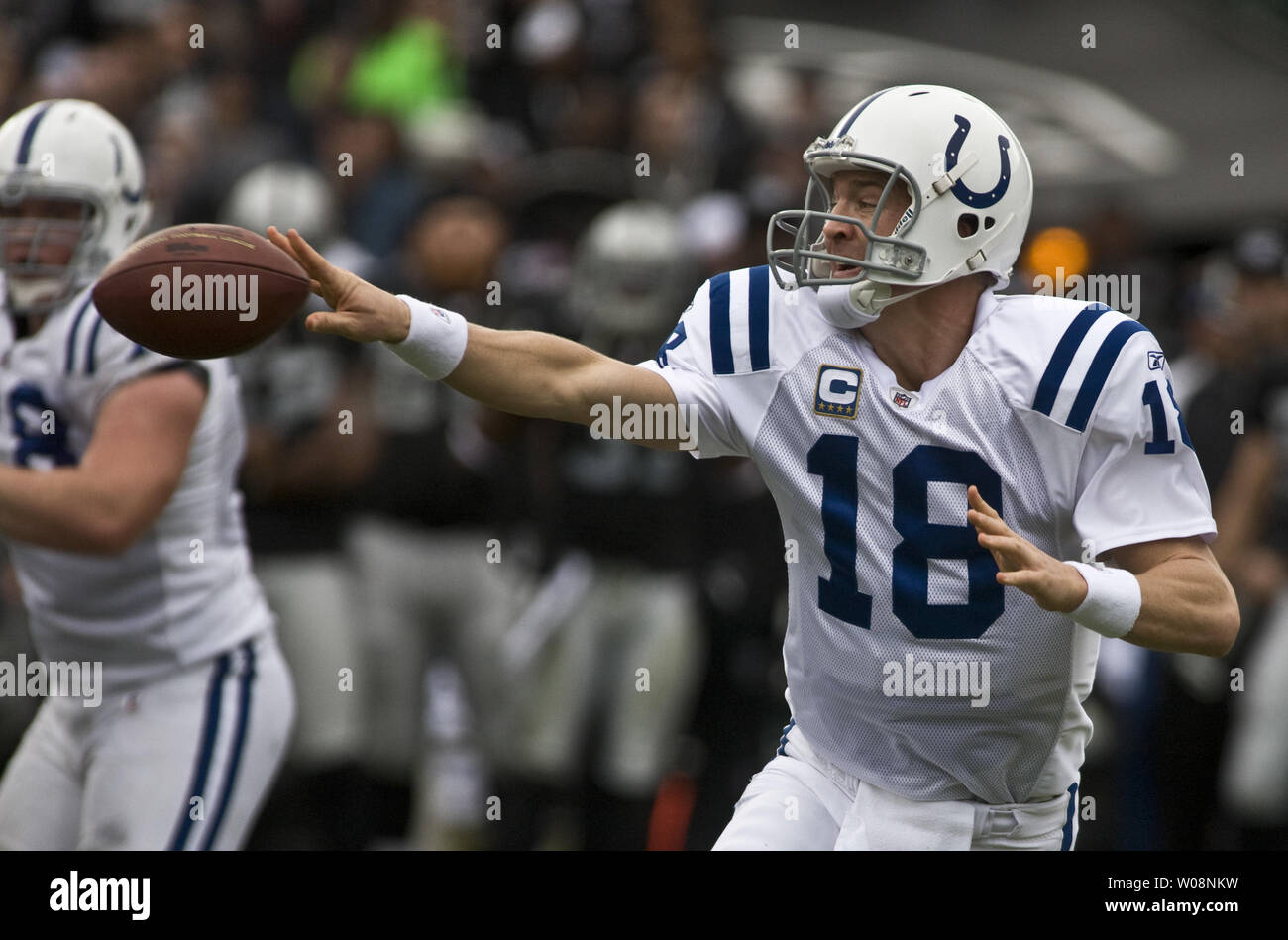 Indianapolis Colts Peyton Manning tosses a shuffle pass against the  Oakland Raiders at the Oakland Coliseum in Oakland, California on December 26, 2010.  The Colts defeated the Raiders 31-26.     UPI/Terry Schmitt Stock Photo