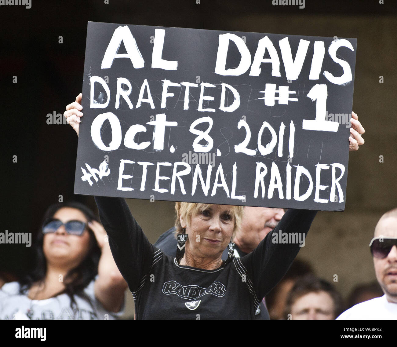 Oakland Raiders fans pay tribute to the late Al Davis, the Raiders' owner  who died 10/8, at the Coliseum before a game against the Cleveland Browns  on October 16, 2011 in Oakland