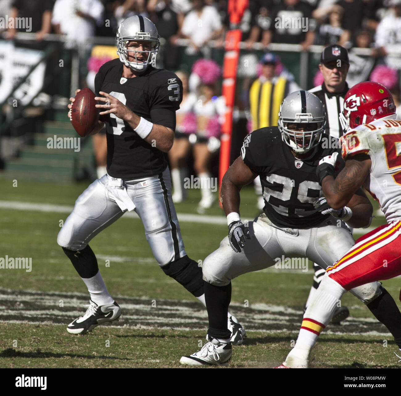 Oakland Raiders QB Kyle Boller (L) looks for a receiver in the first half against the Kansas City Chiefs at the O.co Coliseum in Oakland, California on October 23, 2011. Boller threw three interceptions in the 28-0 loss to the Chiefs.   UPI/Terry Schmitt Stock Photo