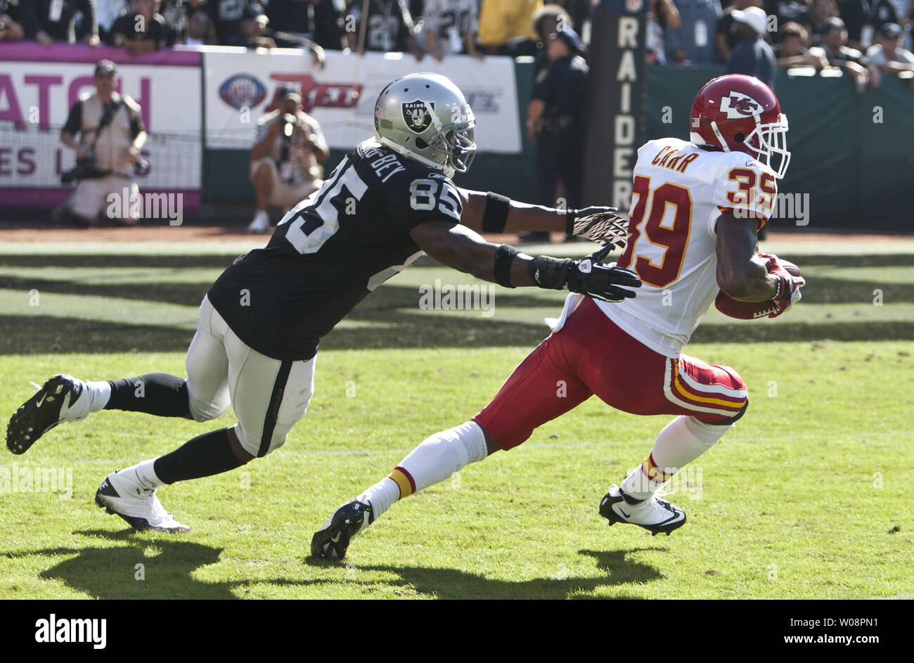 Oakland Raiders WR Darrius Hayward-Bey (85) tries to tackle Kansas City Chiefs Brandon Carr (39) after Carr intercepted a Kyle Boller pass  in the second quarter at the O.co Coliseum in Oakland, California on October 23, 2011. The Raiders threw six interceptions in the 28-0 loss to the Chiefs.   UPI/Terry Schmitt Stock Photo