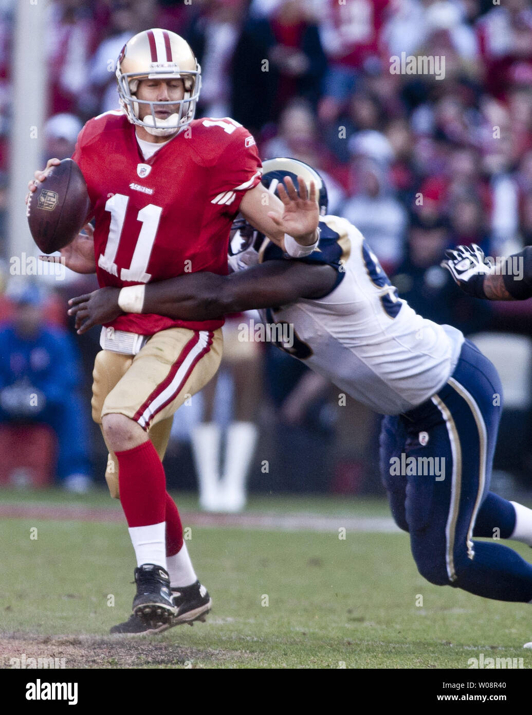 San Francisco 49ers QB Alex Smith (11) is sacked by St. Louis Rams James Hall in the third quarter at Candlestick Park in San Francisco on December 4, 2011. The 49ers defeated the Rams 26-0 to clinch the NFC West.  UPI/Terry Schmitt Stock Photo