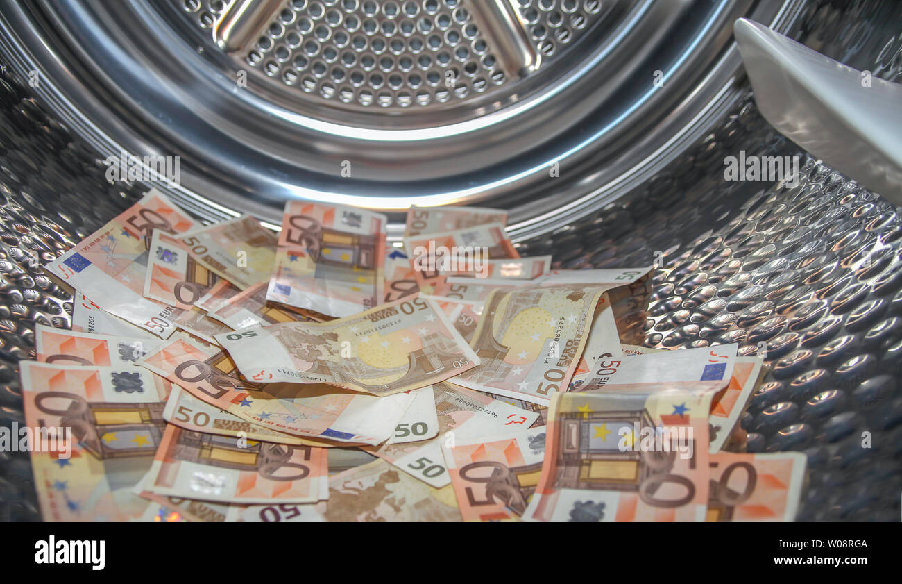 Euros inside washing machine. Concept for money laundering Stock Photo