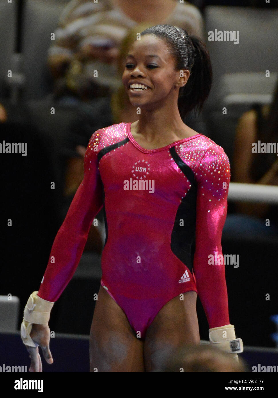 Gabrielle Douglas smiles after her vault at the US Olympic trials in