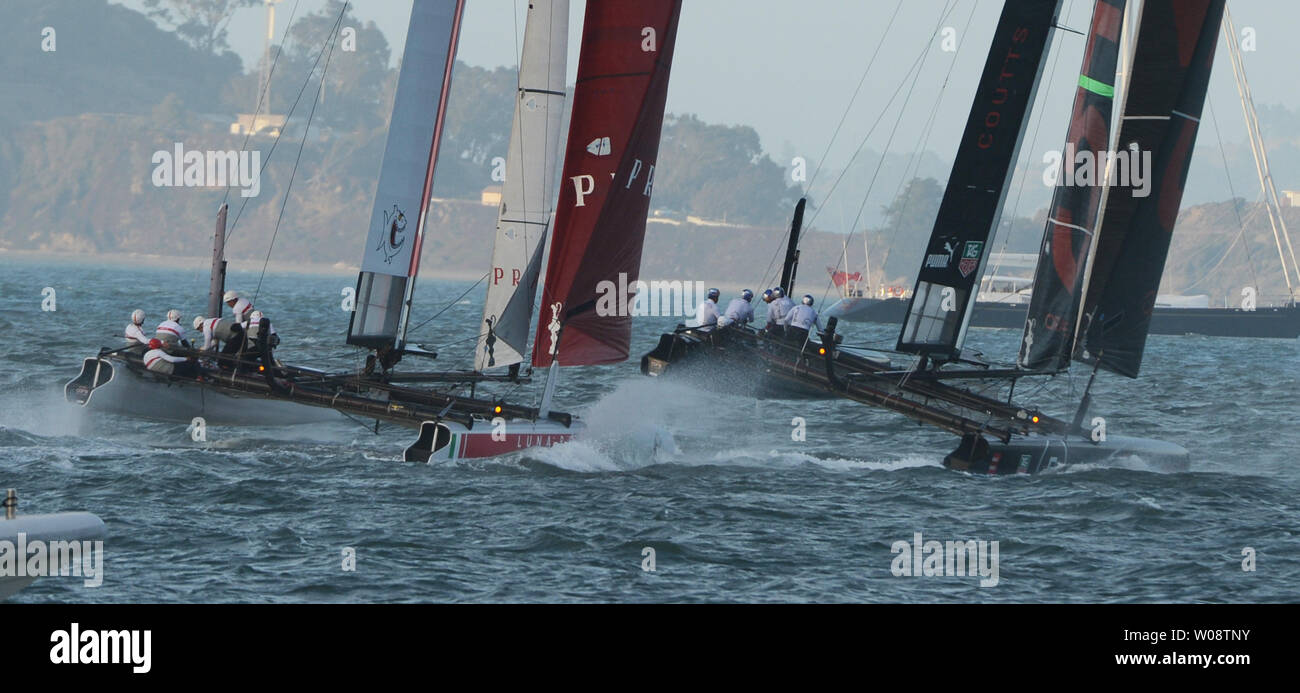 Luna Rossa Piranha of Italy (L) and Oracle Team USA skippered by Russell Coutts run side by side in a fleet race in the America's Cup World Series on San Francisco Bay on October 4, 2012.    UPI/Terry Schmitt Stock Photo