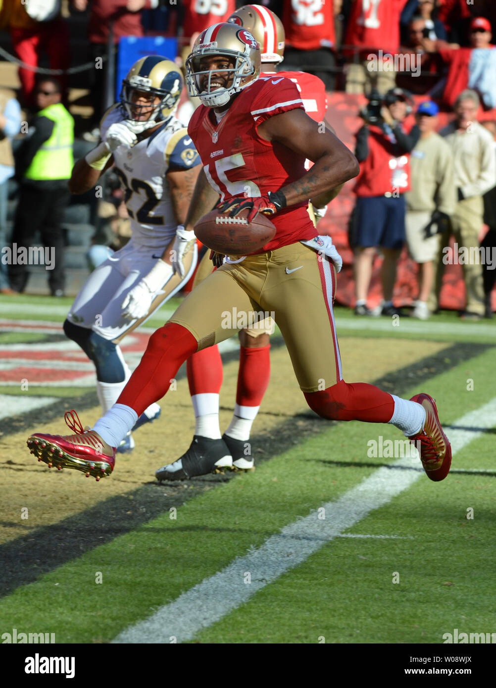 San Francisco 49ers Michael Crabtree (15) is pursued by New Orleans Saints  Tracy Porter (22) and Malcolm Jenkins (27) at Candlestick Park in San  Francisco on September 20, 2010. The Saints defeated