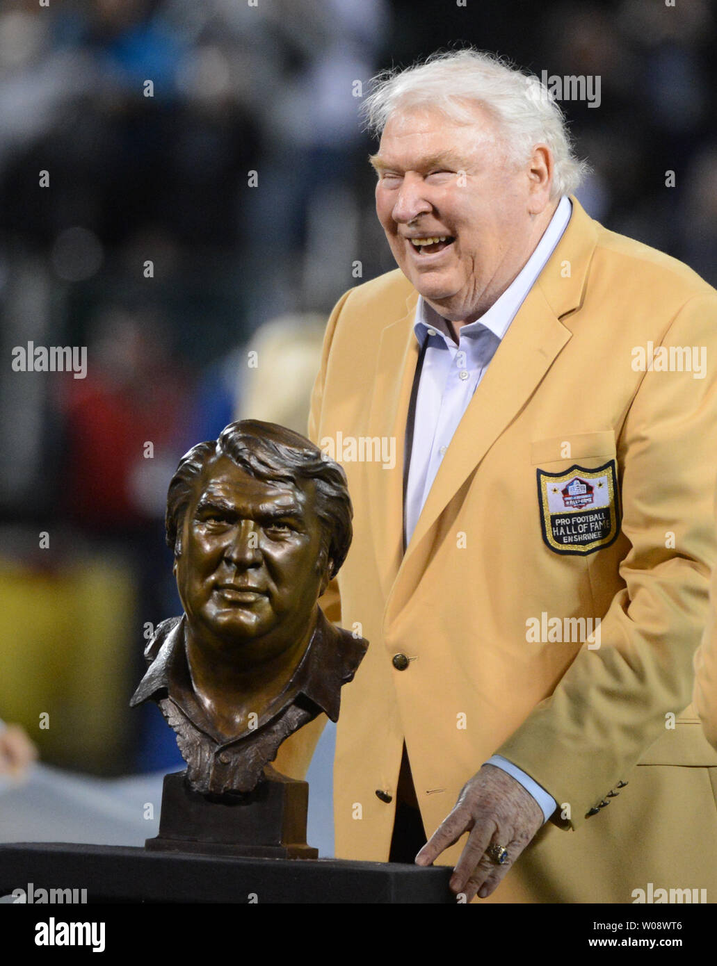Oakland Raiders Hall of Fame coach John Madden stands with his bust during halftime ceremonies as the Raiders play the Denver Broncos at O.co Coliseum in Oakland, California on December 6, 2012. The Broncos defeated the Raiders 26-13.  UPI/Terry Schmitt Stock Photo