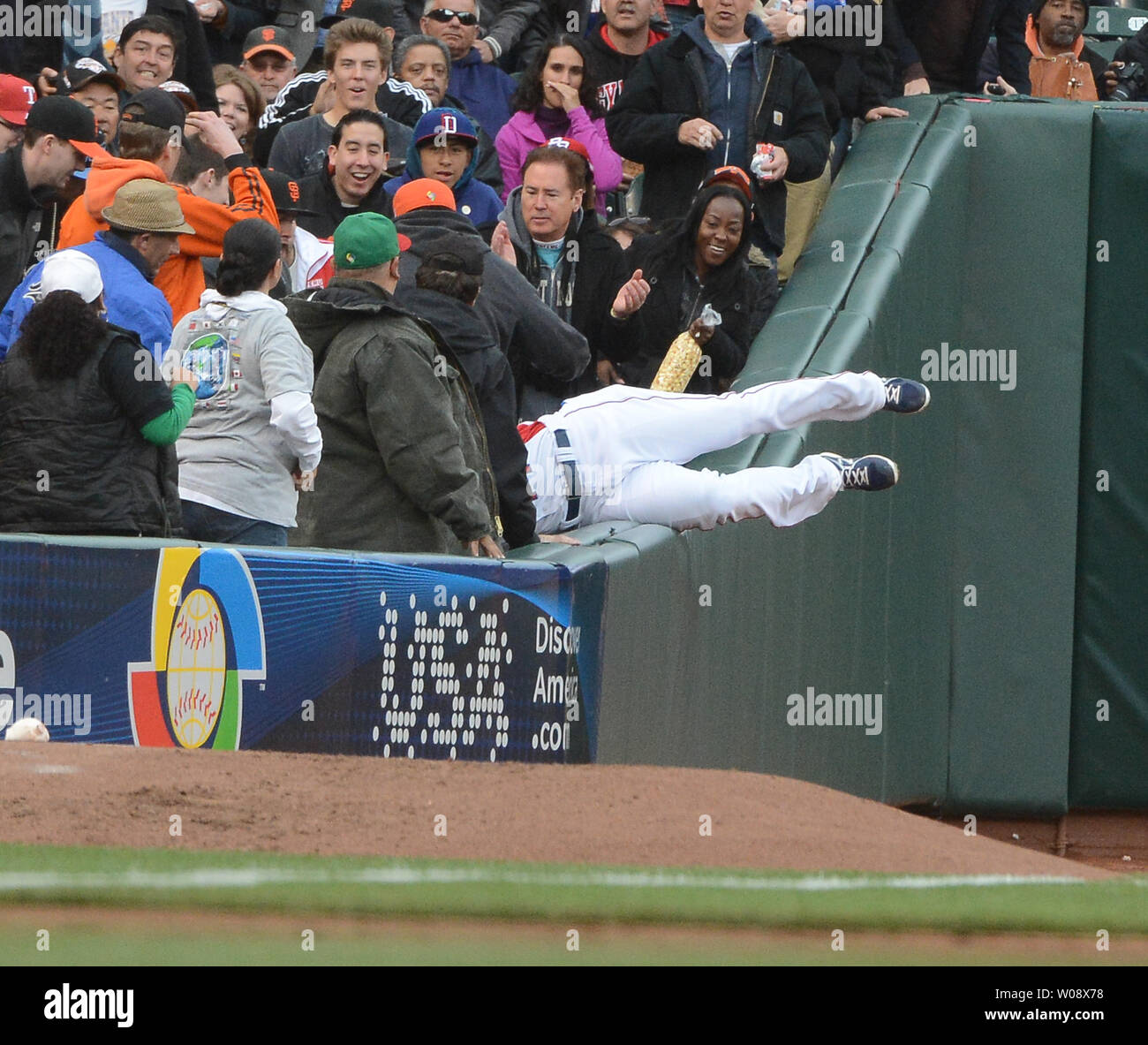 Dominican Republic's LF Ricardo Nanita dives into the stands in foul territory to snare a fly ball by Netherlands Andruw Jones in the first inning of the semi finals of the World Baseball Classic at AT&T Park in San Francisco on March 18, 2013. Dominican Republic defeated Netherlands 4-1.   UPI/Terry Schmitt Stock Photo