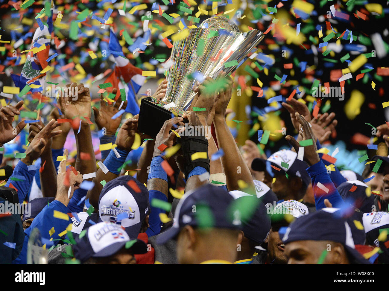The Dominican Republic baseball team celebrates with the championship trophy at the World Baseball Classic championship at AT&T Park in San Francisco on March 19, 2013.  Dominican Republic beat Puerto Rico 3-0 to win the WBC tourney.     UPI/Terry Schmitt Stock Photo