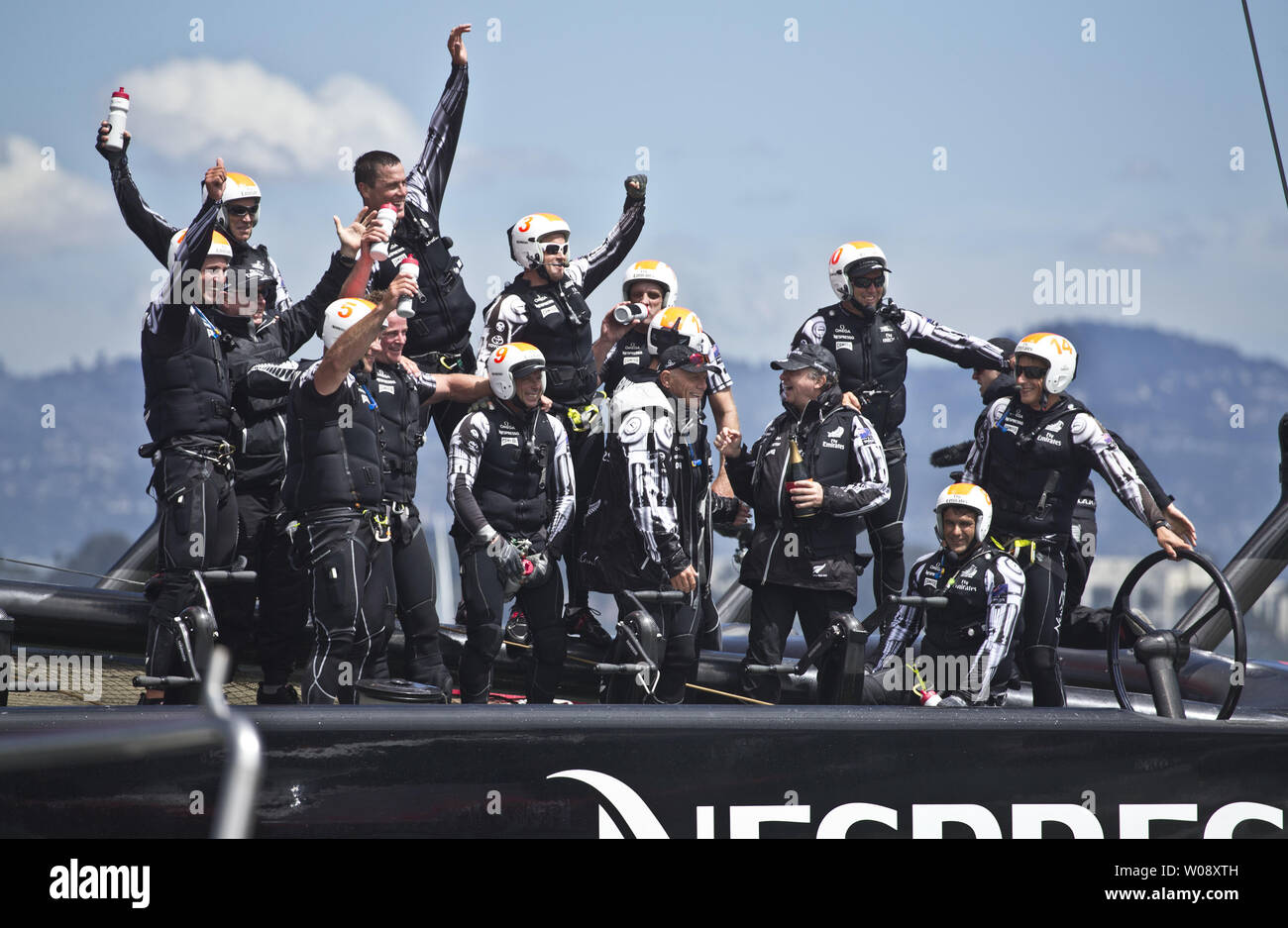 Emirates New Zealand crew celebrates defeating Italy's Luna Rossa Challenge to win the Louis Vuitton Cup finals in San Francisco on August 25, 2013.  The Kiwis won the best of 13 series 7-1 to win the cup and move on to race Oracle Team USA in the America's Cup.     UPI/Terry Schmitt Stock Photo