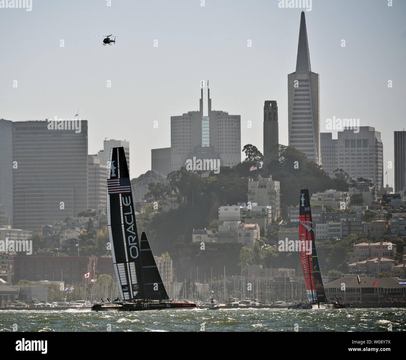Oracle Team USA (L) leads Emirates New Zealand upwind in race 12 of the America's Cup Regatta on San Francisco Bay on September 19, 2013. The Americans lead all the way and won the race. The score is now 8-2 for the Kiwis.     UPI/Terry Schmitt Stock Photo