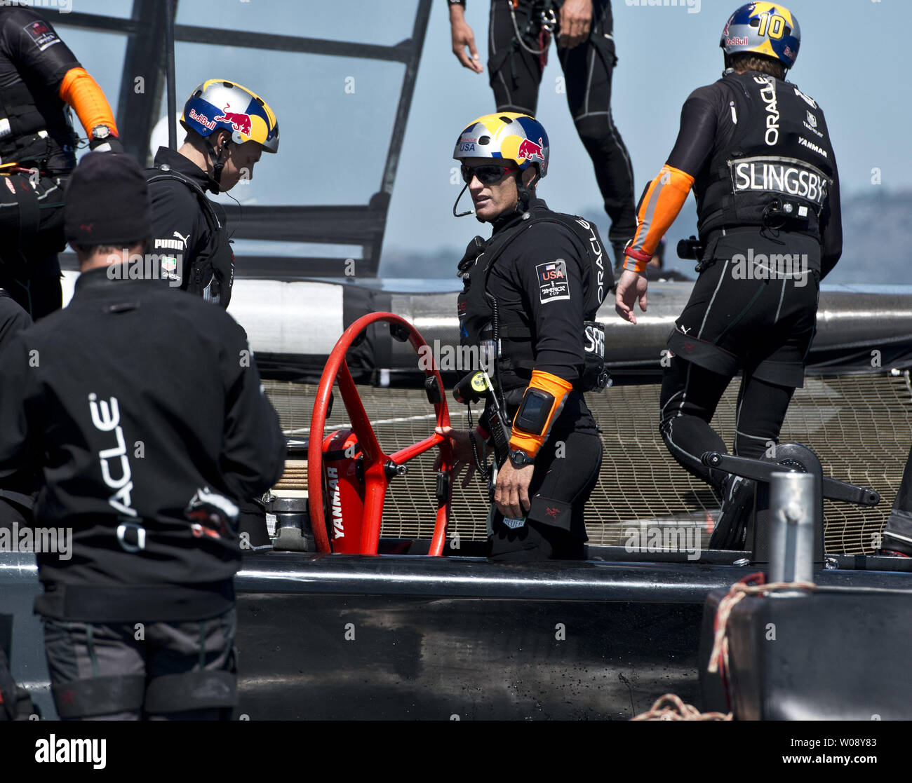 Oracle Team USA skipper Jimmy Spithill (C) talks to the support crew after they defeated Emirates New Zealand in race 12 of the America's Cup Regatta against Emirates New Zealand on San Francisco Bay on September 19, 2013. The Americans lead all the way and won the race. The score is now 8-2 for the Kiwis.     UPI/Terry Schmitt Stock Photo