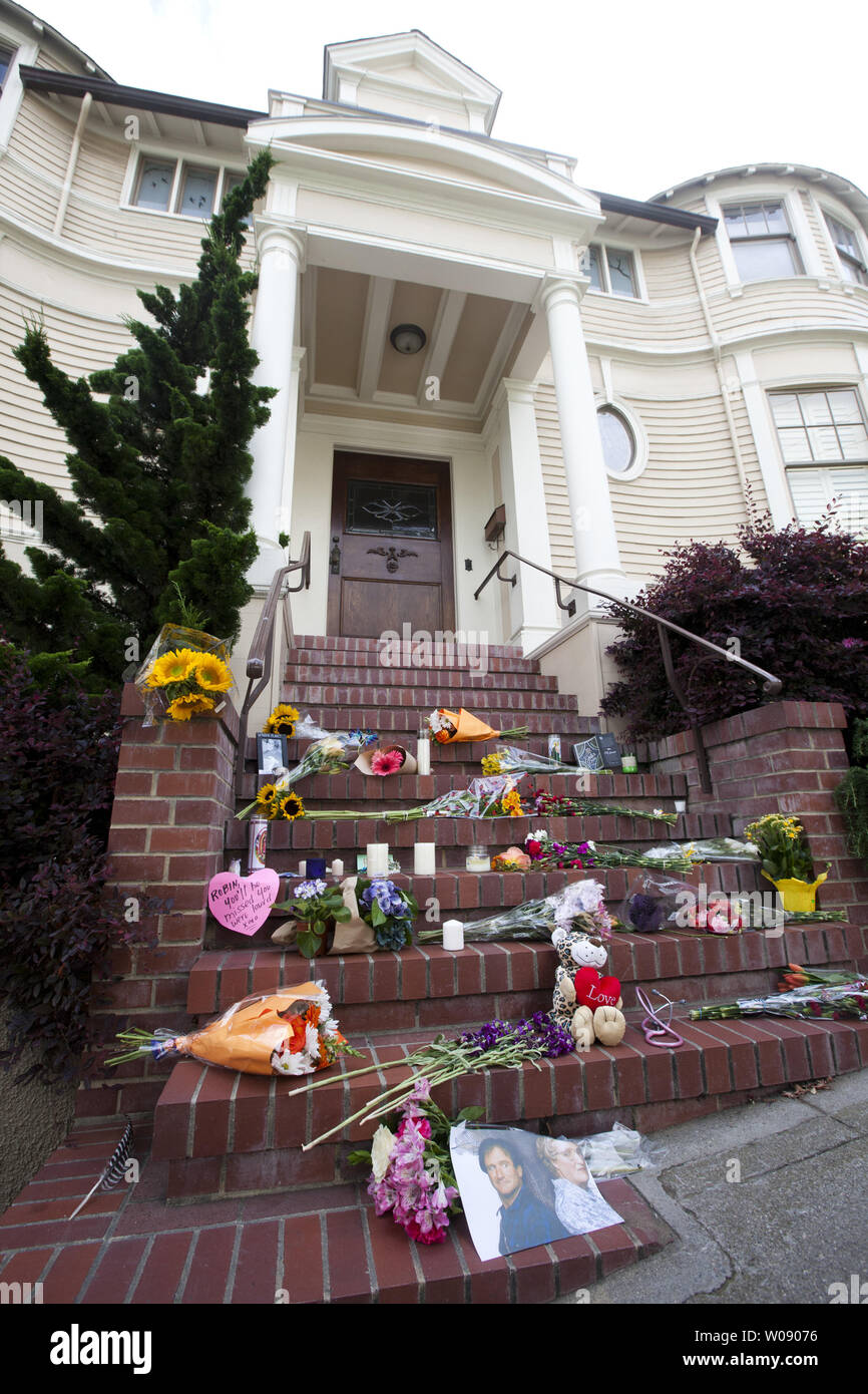 A makeshift shrine to Robin Williams grows at the San Francisco Victorian house used in the 1993 movie 'Mrs. Doubtfire' on August 12, 2014. Williams died of asphyxia after hanging himself August 11. He was 63.     UPI/Terry Schmitt Stock Photo