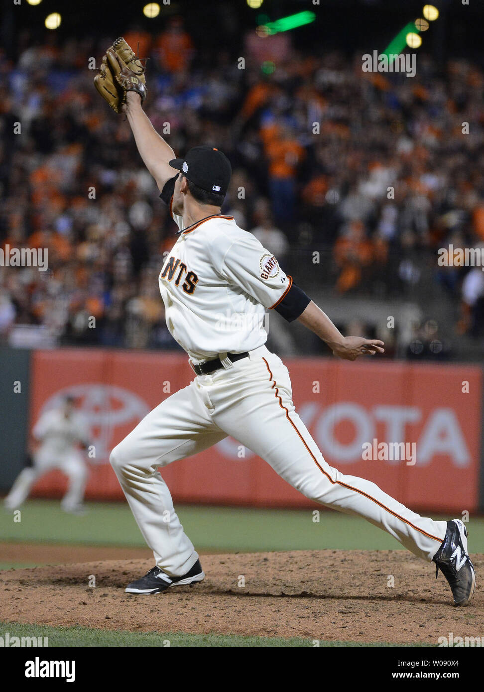 San Francisco Giants reliever Javier Lopez turns and watches  RBI single by Kansas City first baseman Eric Hosmer during the sixth inning of game 3 of the World Series at AT&T Park in San Francisco on October 24, 2014.  UPI/Terry Schmitt Stock Photo