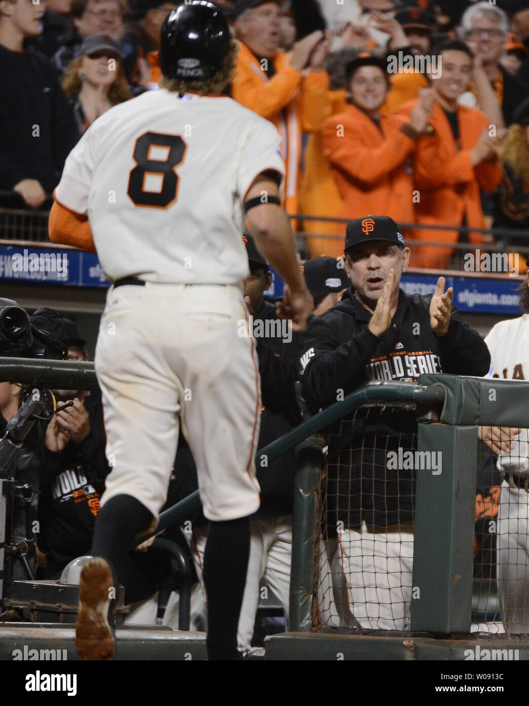 October 25, 2014: San Francisco Giants third baseman Joaquin Arias (13)  applauds after getting on second base in the 6th inning, during game 4 of  the World Series between the San Francisco