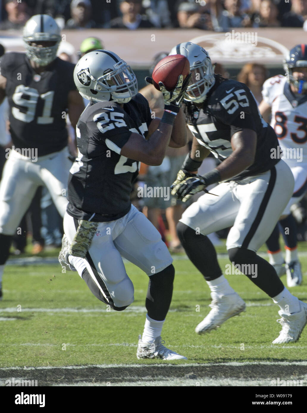 Oakland Raiders DJ Hayden (25) intercepts a Denver Broncos Peyton Manning pass in the first quarter at O.co Coliseum in Oakland, California on November 9, 2014. The Broncos defeated the winless Raiders 41-17.     UPI/Terry Schmitt Stock Photo