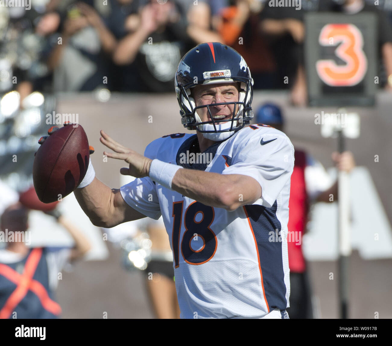 Denver Broncos Peyton Manning (18) throws on third down against the Oakland Raiders in the first quarter at O.co Coliseum in Oakland, California on November 9, 2014. The Broncos defeated the winless Raiders 41-17.     UPI/Terry Schmitt Stock Photo