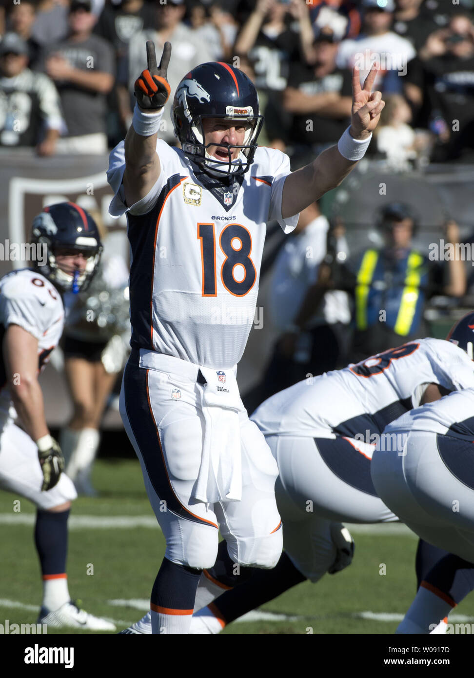 Denver Broncos Peyton Manning (18) calls out a play against the Oakland Raiders in the first quarter at O.co Coliseum in Oakland, California on November 9, 2014. The Broncos defeated the winless Raiders 41-17.     UPI/Terry Schmitt Stock Photo