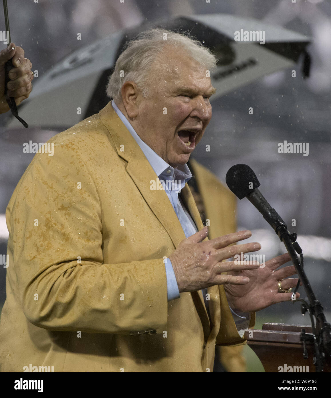 Oakland Raiders Hall of Fame coach John Madden speaks at a ceremony honoring newest HOF inductee punter Ray Guy at halftime of a game against the Kansas City Chiefs at O.co Coliseum in Oakland, California on November 20, 2014. The 1-10 Raiders notched their first win in 368 days, beating the Chiefs 24-20.   UPI/Terry Schmitt Stock Photo