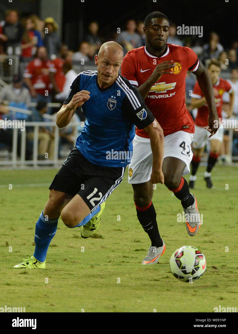 San Jose Earthquakes Mark Sherrod (12) dribbles ahead of Manchester United's Tyler Blackett in the second half in the 2015 International Champions Cup North America at Avaya Stadium in San Jose, California on July 21, 2015. Manchester defeated San Jose 3-1.    Photo by Terry Schmitt/UPI Stock Photo