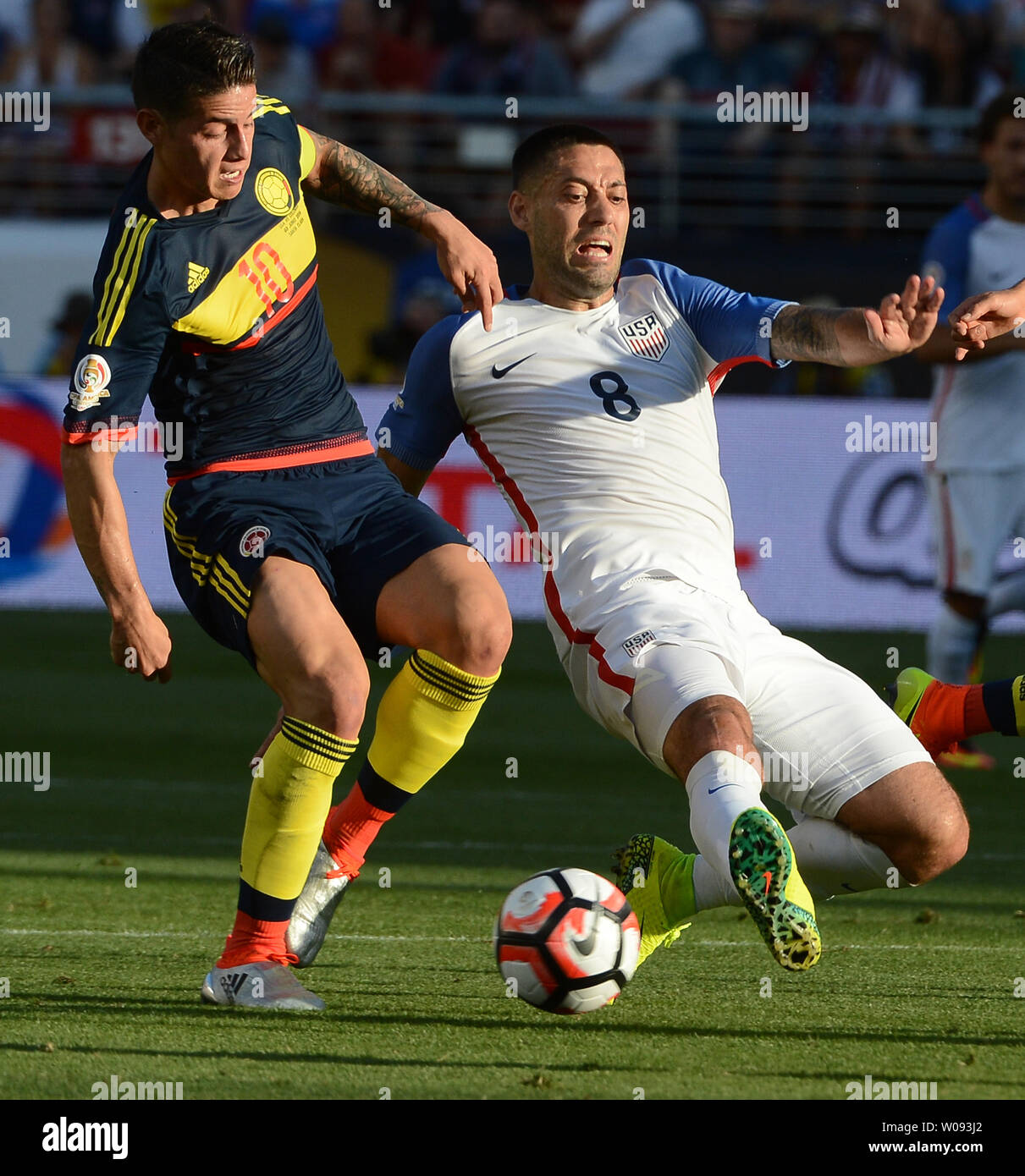 USA's Clint Dempsey loses his footing as Colombia's James Rodriguez (10) pursues in the first half at COPA America Centenario at Levi's Stadium in Santa Clara, California on June 3, 2016.  Colombia won 2-0.   Photo by Terry Schmitt/UPI Stock Photo