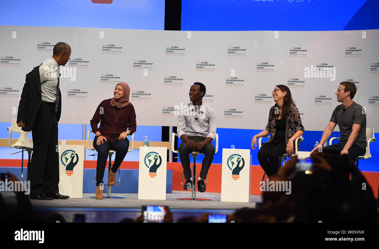 President Barack Obama (L) takes off his coat as he starts a panel discussion with (L-R) Mai Mediate of Egypt, Jean Bosco Nzeyimana of Rwanda, Mariana Costa Checa of Peru, and Facebook founder Mark Zuckerberg at the Global Entrepreneurship Summit 2016 at Stanford University in Palo Alto, California on June 24,  2016. GES aims to connect American entrepreneurs and investors with international counterparts.          Photo by Terry Schmitt/UPI Stock Photo