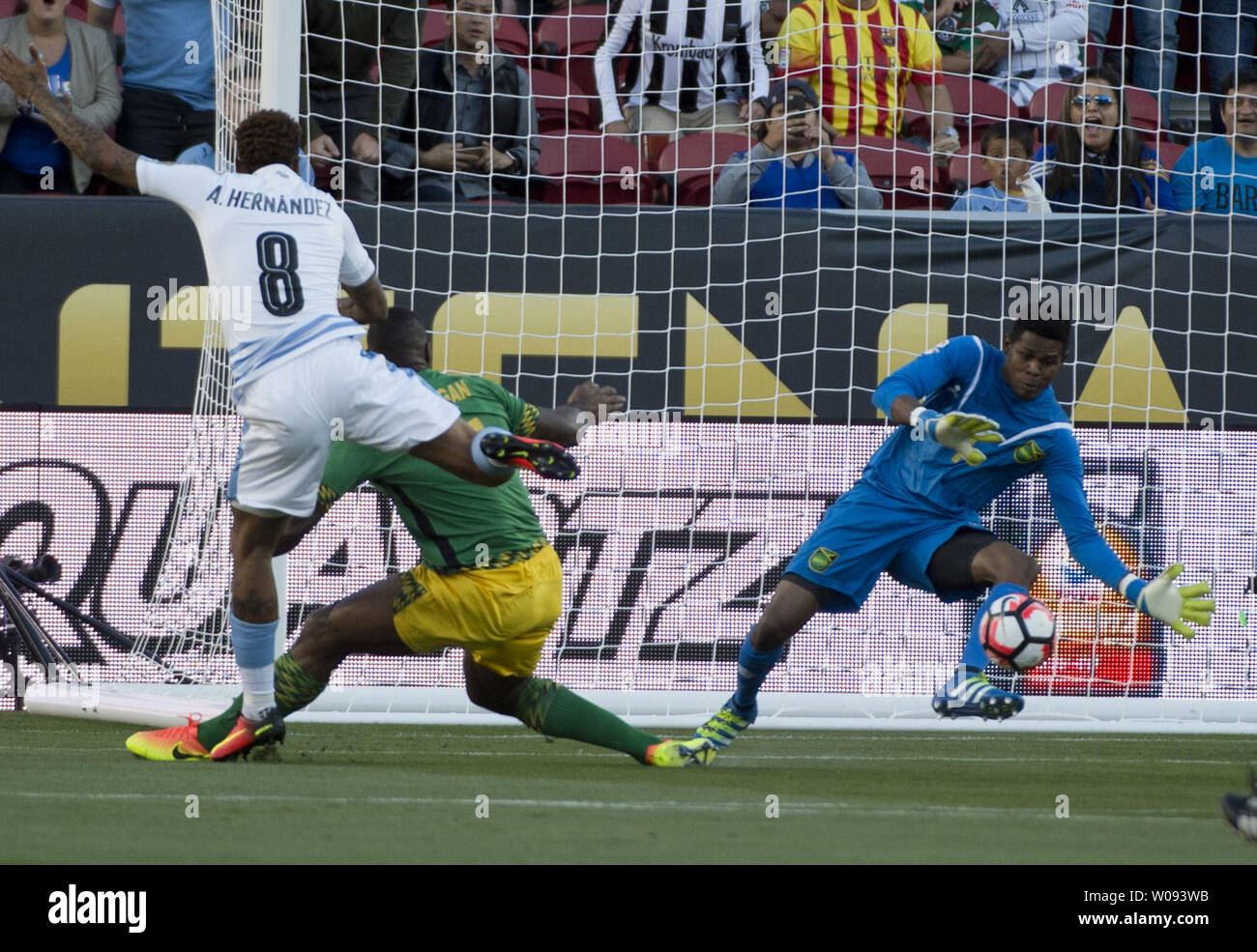 Jamaica's goalie Andre Blake (R) makes a save on a shot by Uruguay's Abel Hernandez (8) in the first half at COPA America Centenario at Levi's Stadium in Santa Clara, California on June 13,  2016.  Uruguay won 3-0.    Photo by Terry Schmitt/UPI Stock Photo