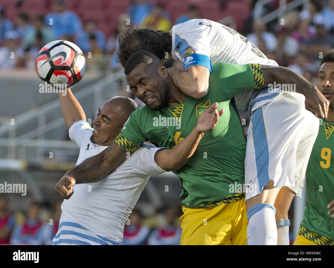 Jamaica's Westley Morgan (C) gets squeezed between Uruguay's Raul Arevlo Rios (L) and Diego Godin on a corner kick in the first half at COPA America Centenario at Levi's Stadium in Santa Clara, California on June 13,  2016.  Uruguay won 3-0.    Photo by Terry Schmitt/UPI Stock Photo