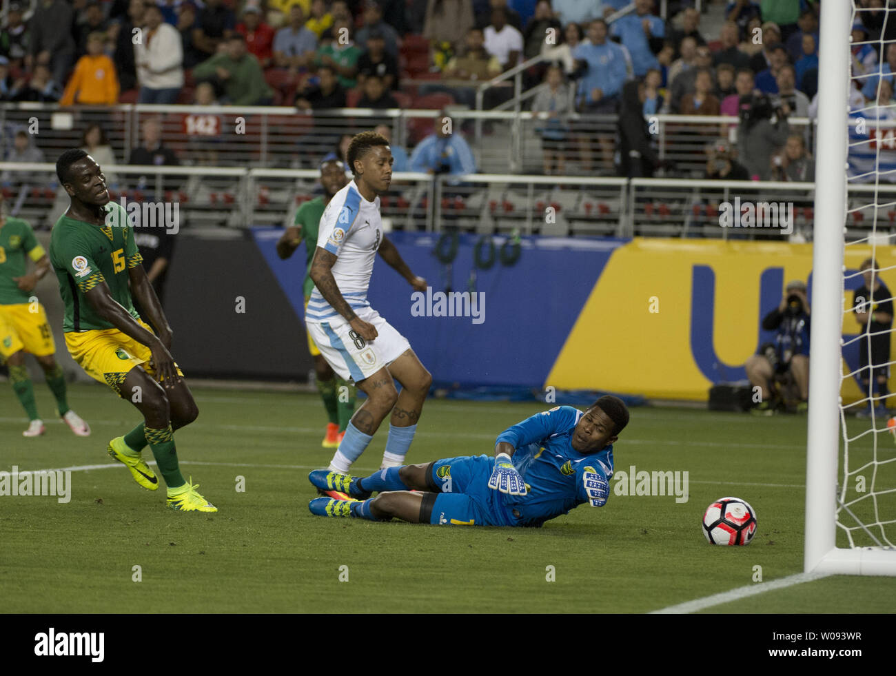 Jamaica's Je-Vaughn Watson (5) reacts as he deflects the ball past diving goalie Andre Blake (R) for an own goal as Uruguay's Abel Hernandez (C) looks on in the second half at COPA America Centenario at Levi's Stadium in Santa Clara, California on June 13,  2016.  J Uruguay won 3-0.    Photo by Terry Schmitt/UPI Stock Photo