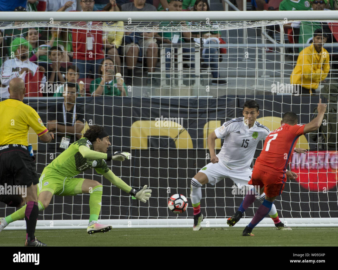 Chile's Alexis Sanchez (7) puts in a goal against Mexico's goalie Guillermo Ochoa (L) in the second half at COPA America Centenario quarter-finals at Levi's Stadium in Santa Clara, California on June 18,  2016. Chile annihilated Mexico 7-0.   Photo by Terry Schmitt/UPI Stock Photo