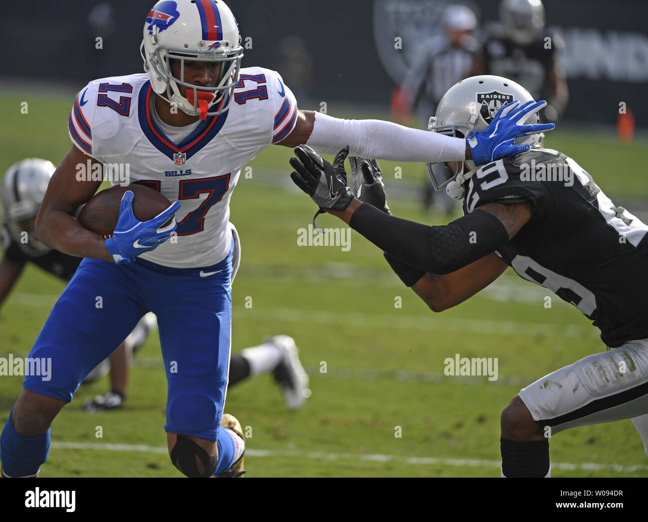 Buffalo Bills WR Justin Hunter (17) fends off Oakland Raiders David Amerson (29) in the first quarter at the Oakland Coliseum in Oakland, California on December 4, 2016. The Raiders defeated the Bills 38-24.         Photo by Terry Schmitt/UPI Stock Photo