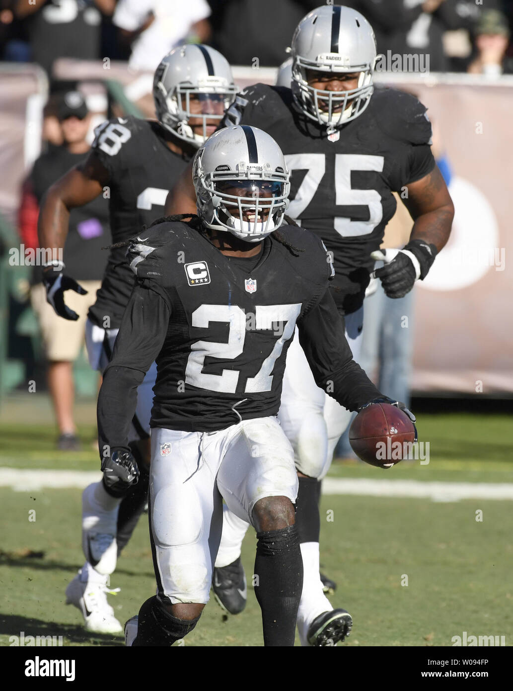 Oakland Raiders Reggie Nelson (27) celebrates intercepting pass