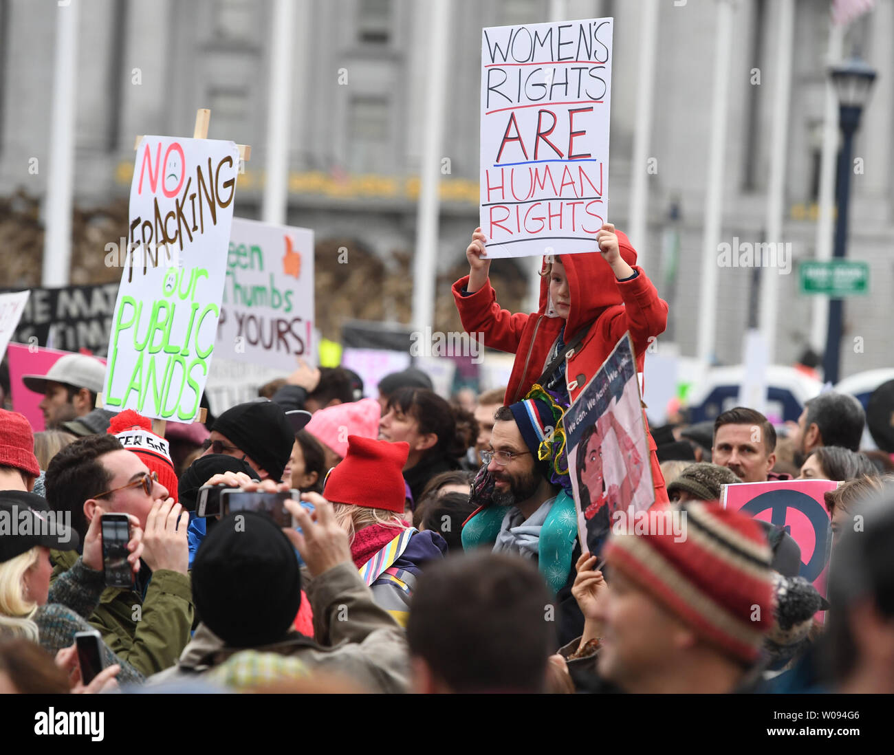 Demonstrators crowd the Civic Center as 100,000 braved the rain to rally and march for women's rights and a host of other causes, in San Francisco on January 21, 2017.          Photo by Terry Schmitt/UPI Stock Photo